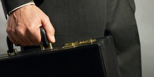 Thumbnail of A sharply dressed Japanese man with a 'self-defense briefcase' has made a living in 'night moving' — helping battered women disappear without a trace