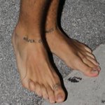Thumbnail of One Direction's Harry Styles Reveals New George Michael-Inspired Ankle Tattoos—Check it Out! - E! Online