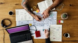 Thumbnail of 5 famous creatives who had a messy desk | Canva